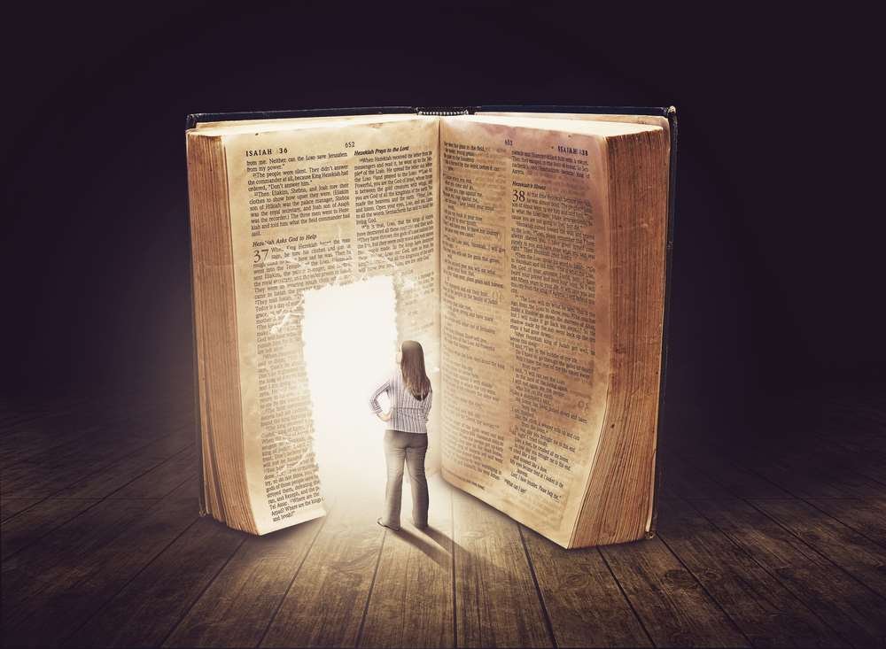 Author contemplating the book publishing process with notes and laptop - Global Banking & Finance Review