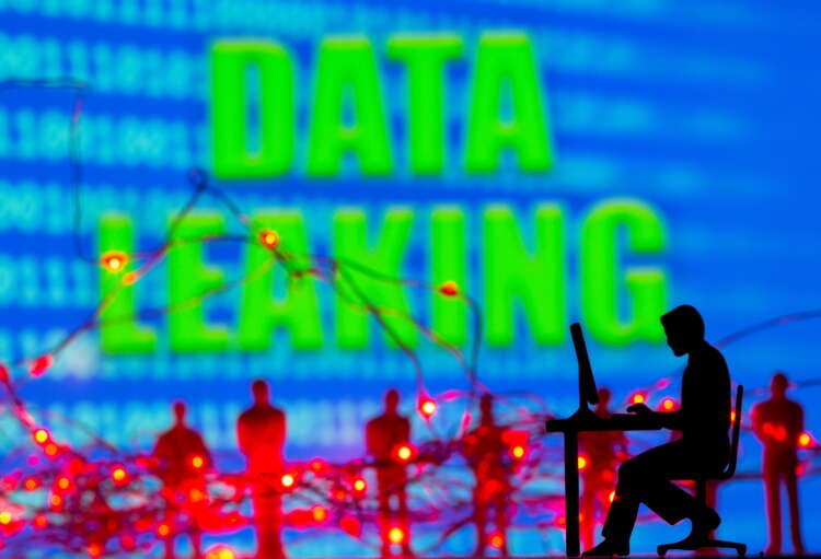 3D illustration of a man at a computer amidst binary code, highlighting the impact of ransomware attacks on businesses - Global Banking & Finance Review