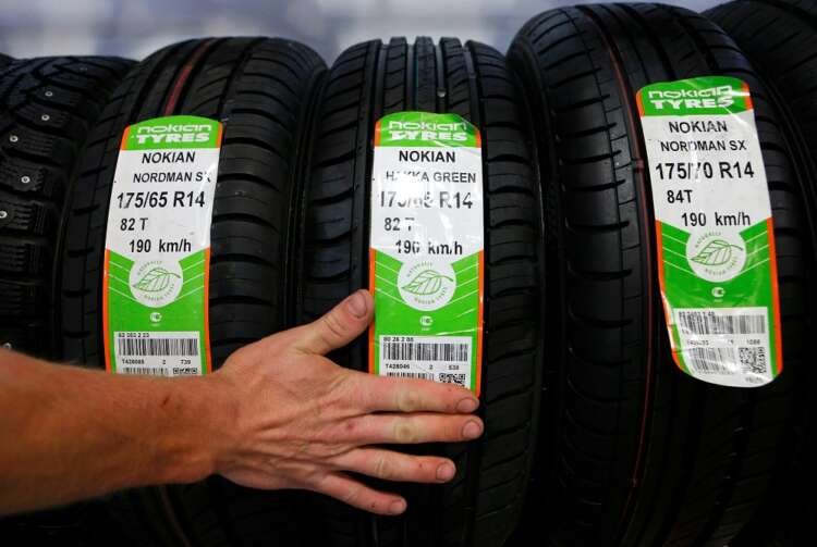 Employee sorting Nokian tyres at a Moscow facility amid company losses - Global Banking & Finance Review