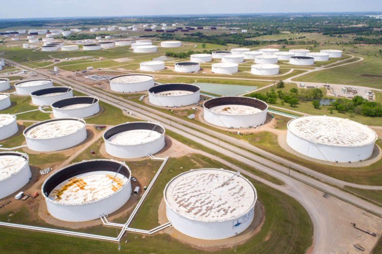 Aerial view of crude oil storage tanks at Cushing, highlighting oil price trends - Global Banking & Finance Review