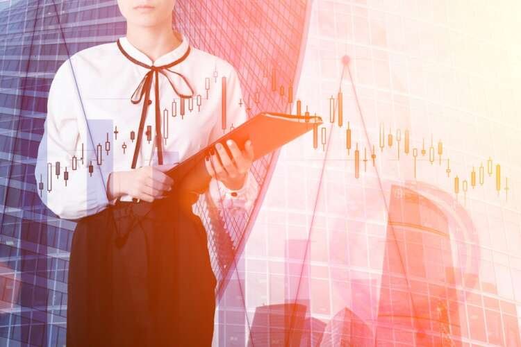 Businesswoman in finance with skyscrapers and financial charts - Global Banking & Finance Review