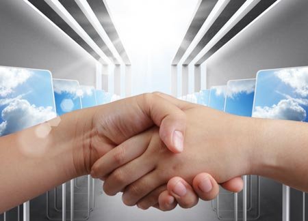Business professionals engaging in a handshake symbolizing collaboration in omnichannel fulfillment - Global Banking & Finance Review