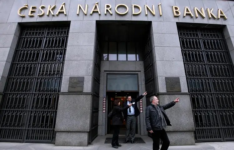 Czech central bank building with financial graphs symbolizing interest rate decisions - Global Banking & Finance Review