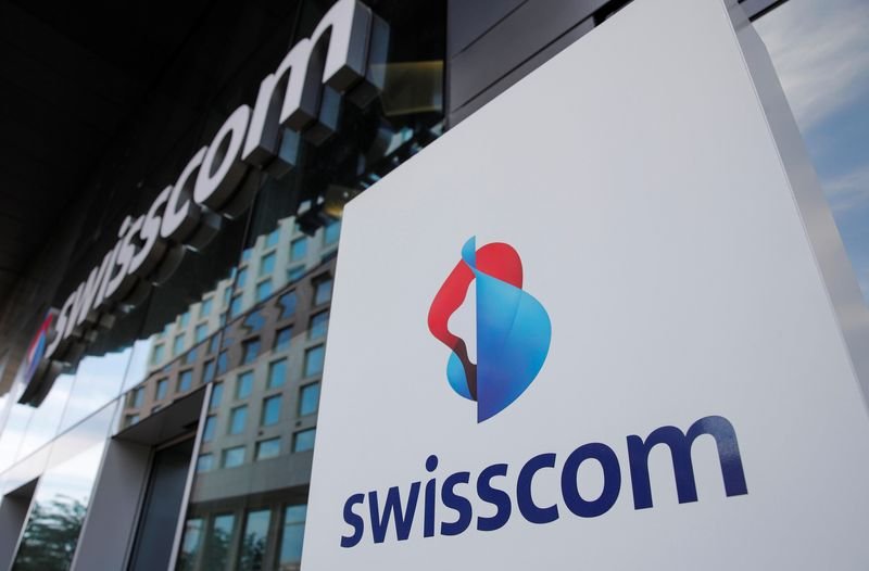 Swisscom logo with declining stock graph, reflecting recent financial results - Global Banking & Finance Review