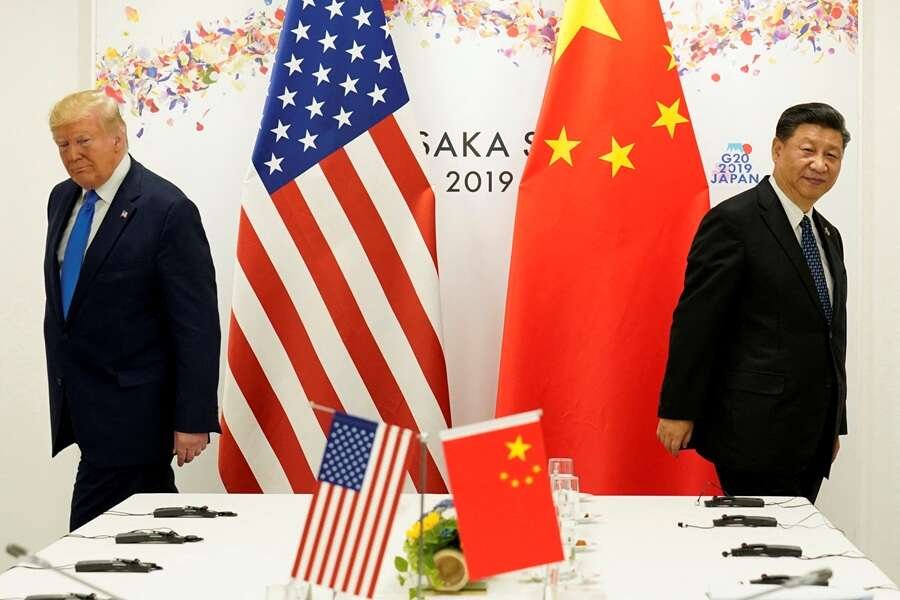 Chinese and U.S. flags symbolizing ongoing diplomatic relations amid rivalry - Global Banking & Finance Review