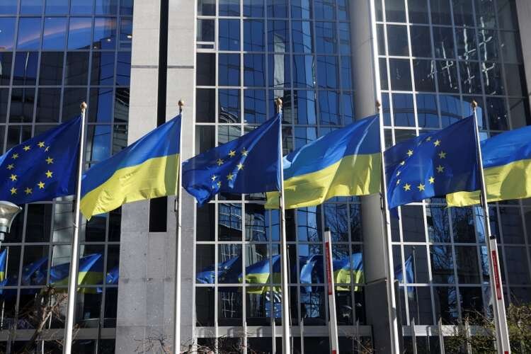 EU and Ukrainian flags outside EU Parliament, symbolizing potential membership talks - Global Banking & Finance Review
