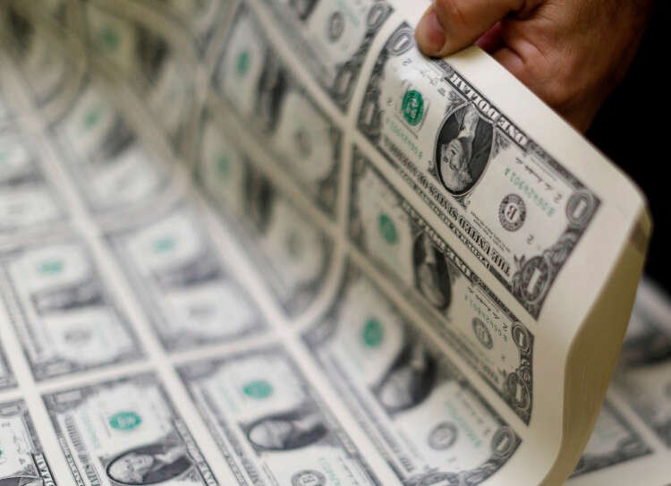 Curled U.S. one dollar bills symbolize dollar's decline near 16-week low - Global Banking & Finance Review