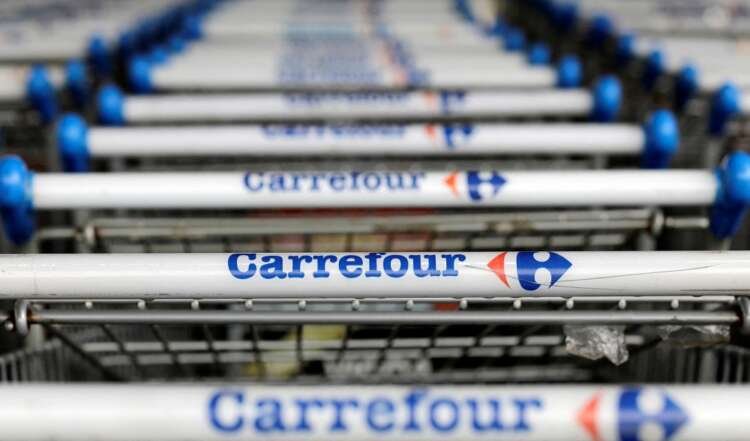 Carrefour logo on shopping trolleys, symbolizing retail strategy in 2022 - Global Banking & Finance Review