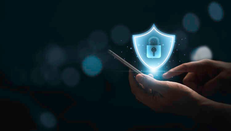 Businessman using smartphone for secure access, highlighting encryption risks in finance - Global Banking & Finance Review