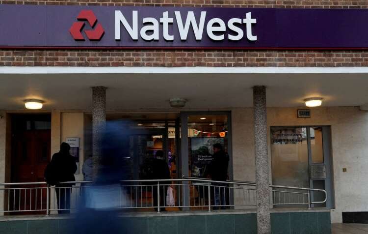 FILE PHOTO: The logo of NatWest Bank is seen outside a branch in London
