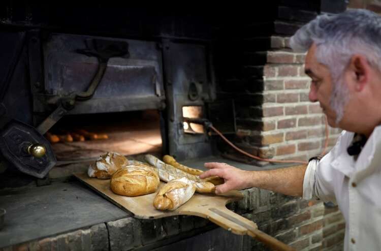 Image for Back to basics: wood-fired oven shields French baker from soaring energy costs
