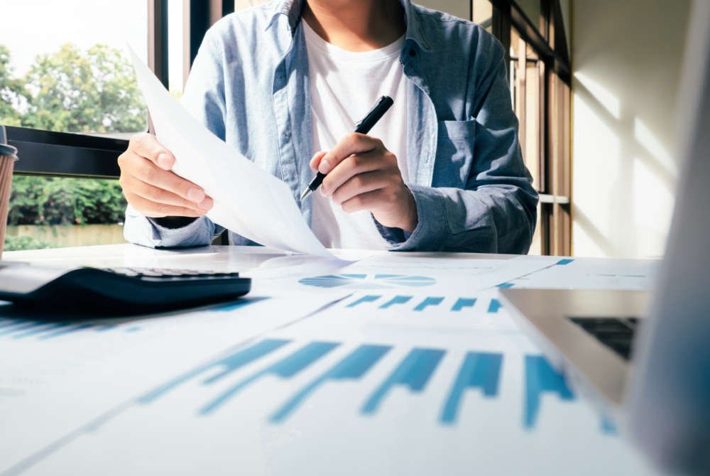 Businessman analyzing investment marketing data for self-directed asset management - Global Banking & Finance Review