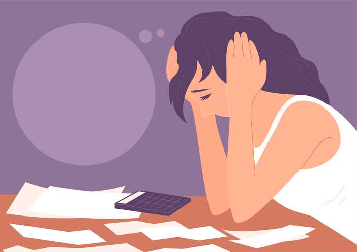 A young woman managing financial stress by organizing debts and expenses - Global Banking & Finance Review