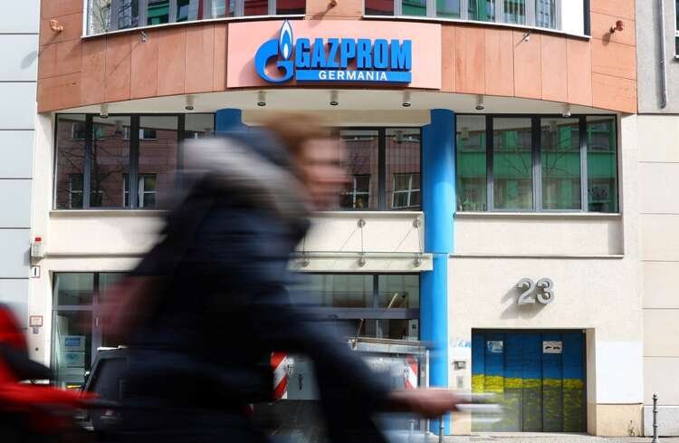 A cyclist passes the Gazprom Germania headquarters in Berlin, highlighting Germany's energy sector - Global Banking & Finance Review