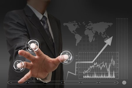 Businessman analyzing technology trends for R&D growth in British firms - Global Banking & Finance Review