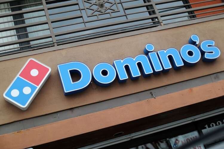 Domino's Pizza restaurant showcasing logo during CEO transition - Global Banking & Finance Review