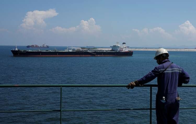Crude oil tanker in Singapore showcasing oil industry amidst demand concerns - Global Banking & Finance Review