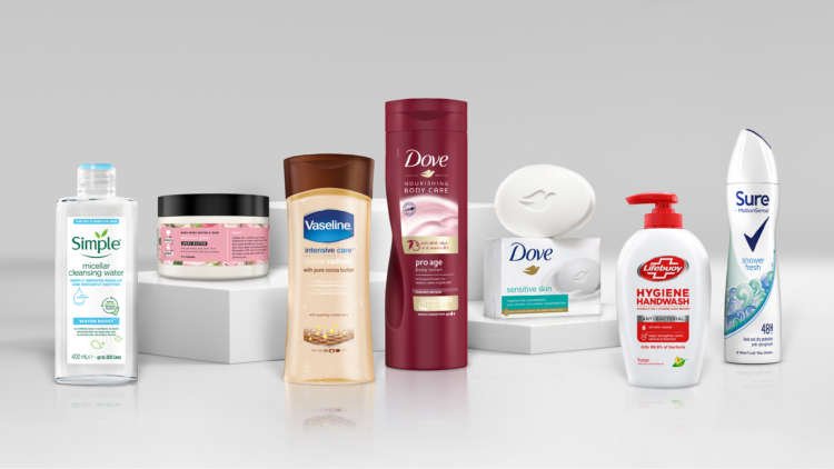 A 2021 handout illustration shows Unilever beauty products without the word ‘normal’ on its product packaging