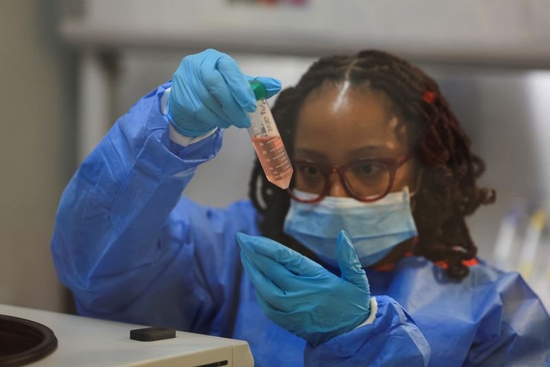 South African lab technician with HIV vaccine samples - Global Banking & Finance Review
