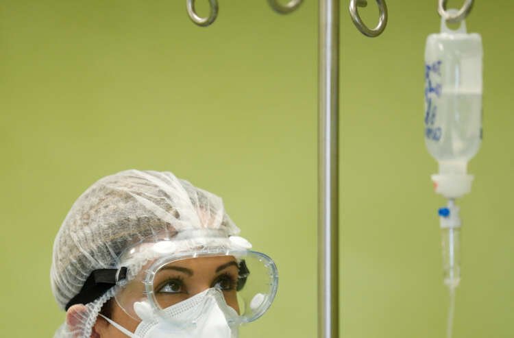 Healthcare professionals administering monoclonal antibody treatment in Italy - Global Banking & Finance Review