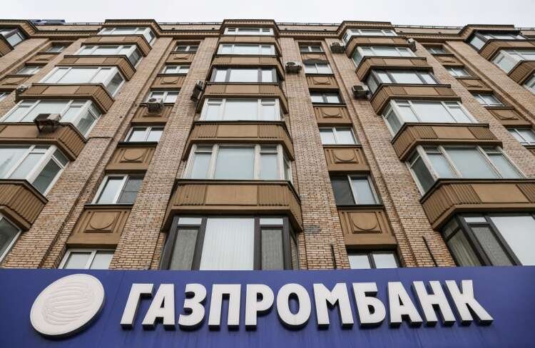 The logo of Gazprombank is seen at a branch office in Moscow