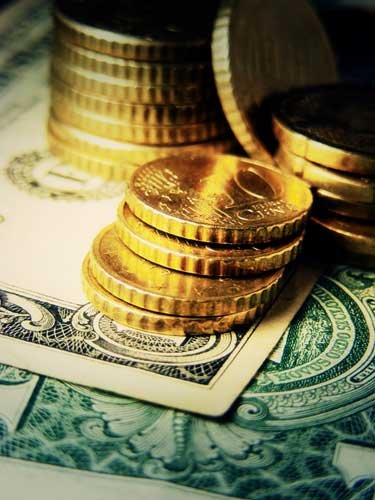 Close-up of stacked coins representing savings for retirement planning - Global Banking & Finance Review