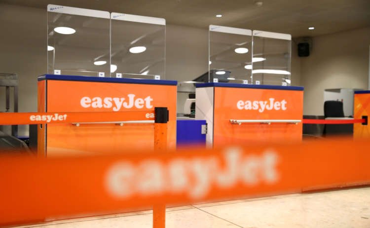 EasyJet check-in counters at the airport, significant for bond issuance news - Global Banking & Finance Review