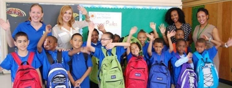 Colorful school backpacks filled with supplies for low-income children - Global Banking & Finance Review