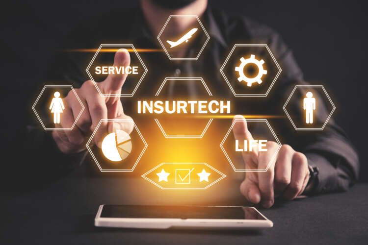 Businessman discussing insurtech innovations with a tablet - Global Banking & Finance Review