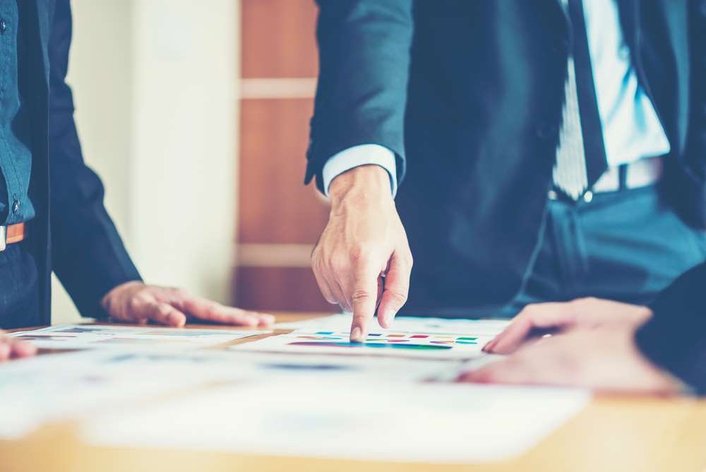 Business analyst analyzing data and presenting solutions in a corporate setting - Global Banking & Finance Review