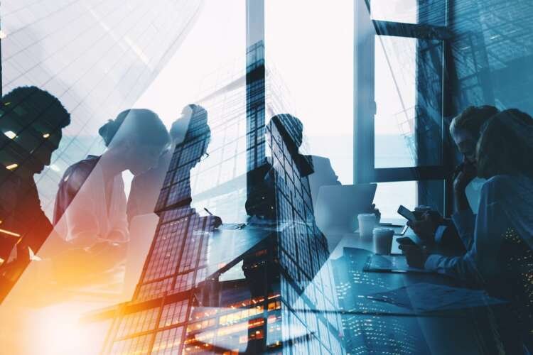 Business professionals collaborating in a digital workspace, reflecting on the SVB failure's impact on finance - Global Banking & Finance Review