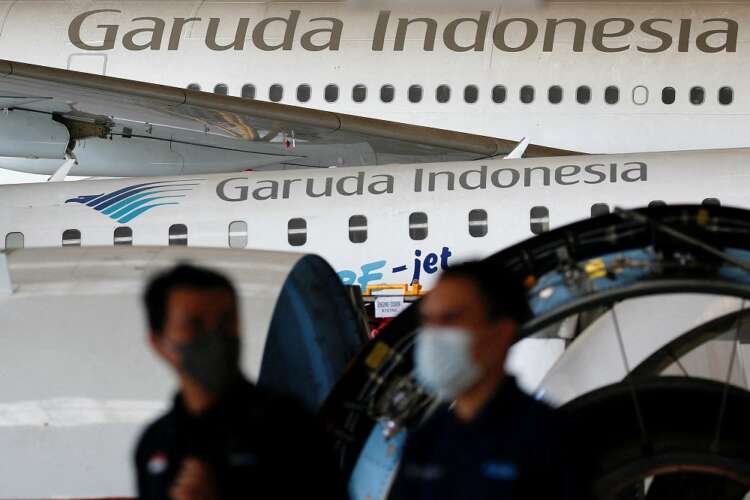 Garuda Indonesia aircraft parked at maintenance facility, reflecting airline's restructuring efforts - Global Banking & Finance Review