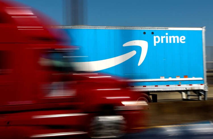 Amazon delivery truck during layoffs announcement in U.S., Canada, and Costa Rica - Global Banking & Finance Review