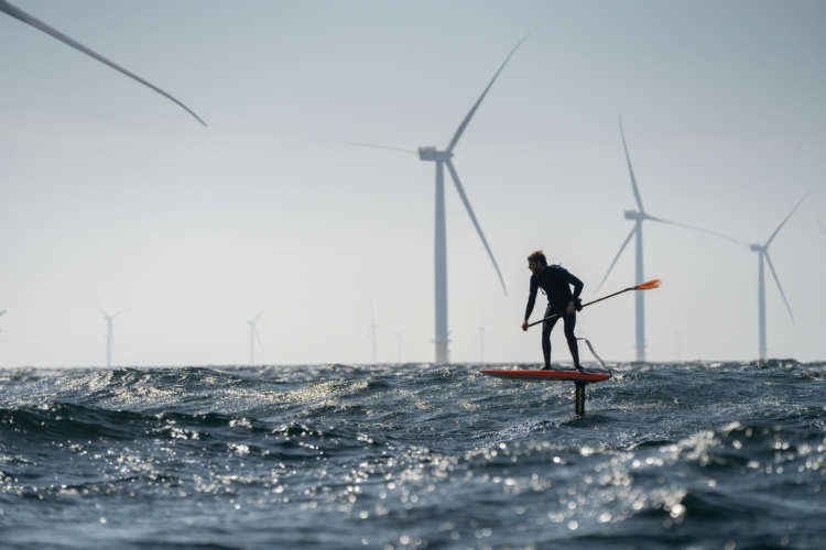 A hydrofoil racing across the waves, showcasing the challenge from Denmark to Sweden - Global Banking & Finance Review