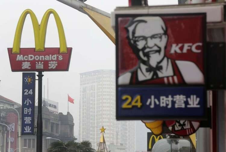 Logos of McDonald's and KFC highlighting fast food industry's climate action - Global Banking & Finance Review