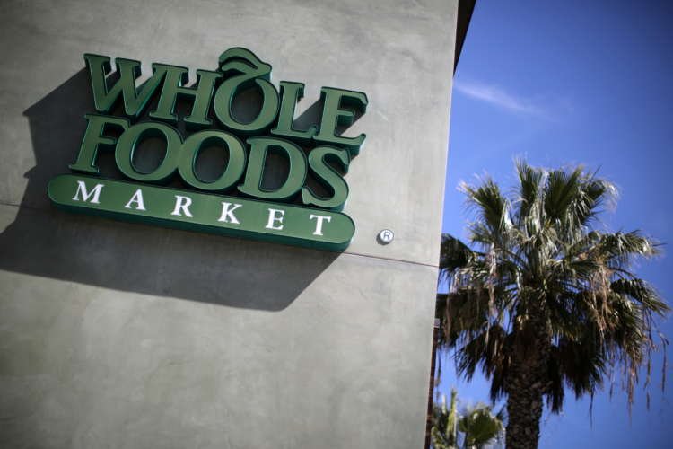 Whole Foods shopper using palm payment technology at Amazon store - Global Banking & Finance Review