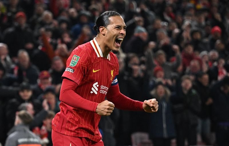 Virgil van Dijk celebrates after scoring in Liverpool's League Cup final match - Global Banking & Finance Review