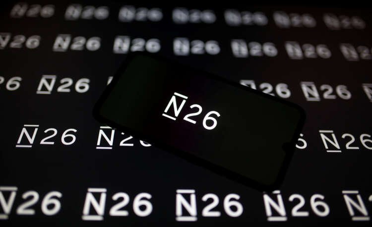 Smartphone displaying N26 logo, symbolizing Allianz's stake sale in fintech - Global Banking & Finance Review