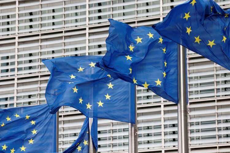 European Union flags outside EU Commission headquarters represent EU's request for equal EV treatment - Global Banking & Finance Review