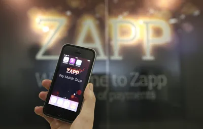 Zapp app on iphone against Zapp logo background