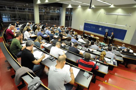 CaixaBank employees celebrating outstanding financial advice exam results - Global Banking & Finance Review