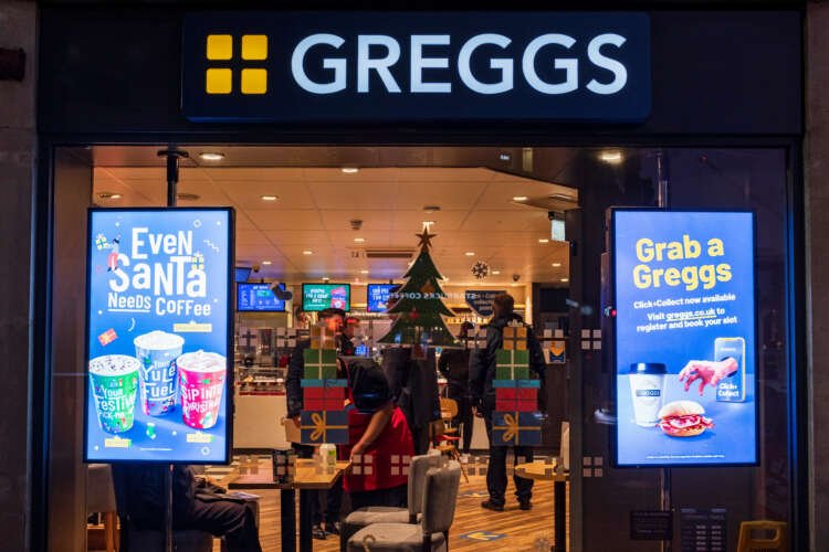 Exterior of a Greggs bakery showcasing popular food offerings - Global Banking & Finance Review