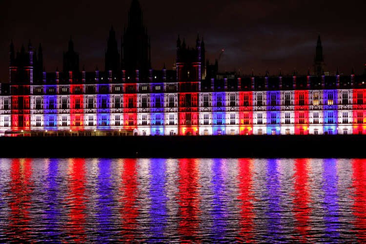 Buildings illuminated in British flag colors, symbolizing post-Brexit insurer capital rule changes - Global Banking & Finance Review
