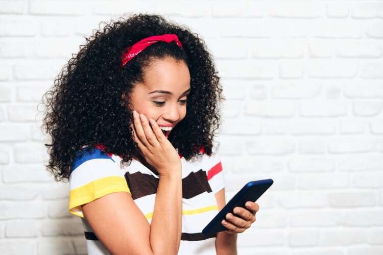 Happy Euphoric Girl Woman Reading Good News On Mobile Telephone