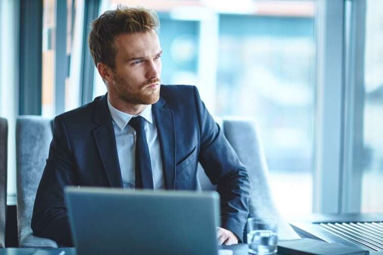 Businessman planning a personal workspace for hybrid work environment - Global Banking & Finance Review