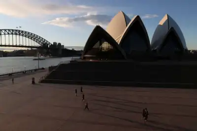 Image for Analysis: Shut off from the world, Australia fosters red-hot growth at home