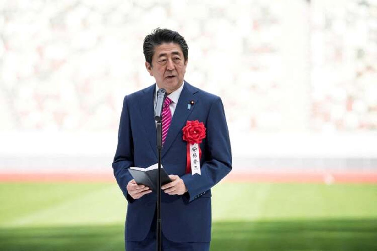 Image of former Japanese Prime Minister Shinzo Abe speaking at a public event - Global Banking & Finance Review