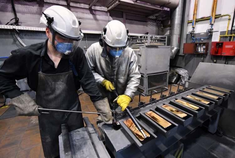 Employees process 99.99% pure gold ingots, highlighting EU sanctions discussions on gold - Global Banking & Finance Review
