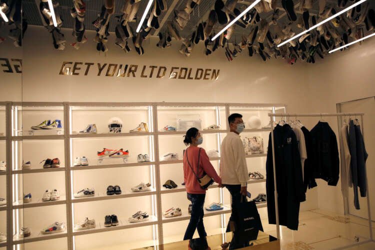 Customers at Golden Goose in Beijing wearing luxury sneakers amid COVID-19 - Global Banking & Finance Review