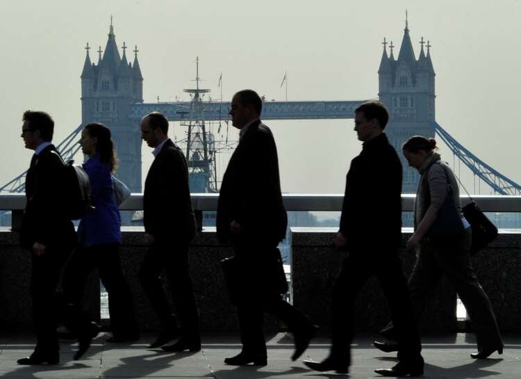 City workers in London navigate the busy streets, symbolizing investment platforms' challenges - Global Banking & Finance Review